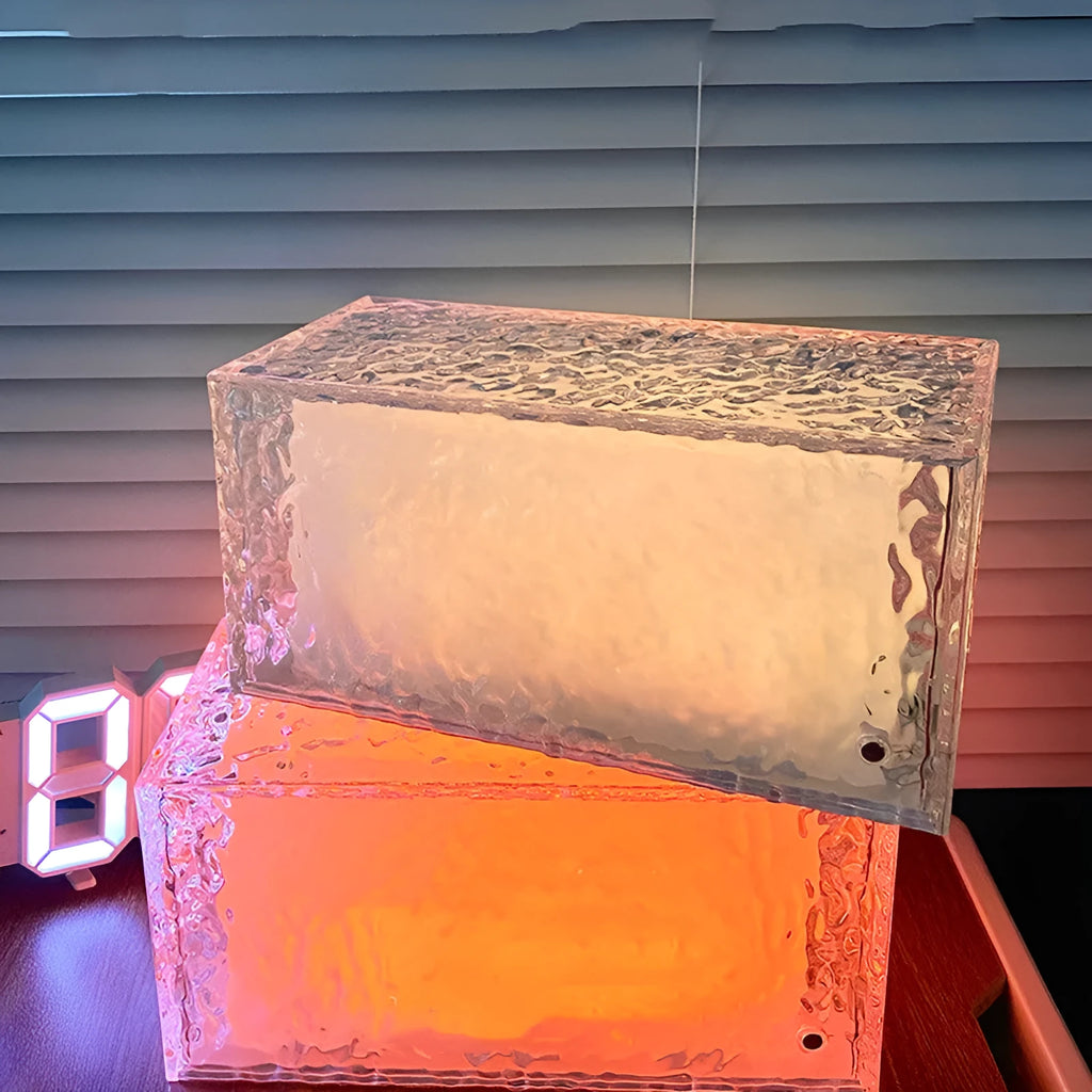Geometric ice cube shaped acrylic night lamp with colour changing illumination on wooden surface
