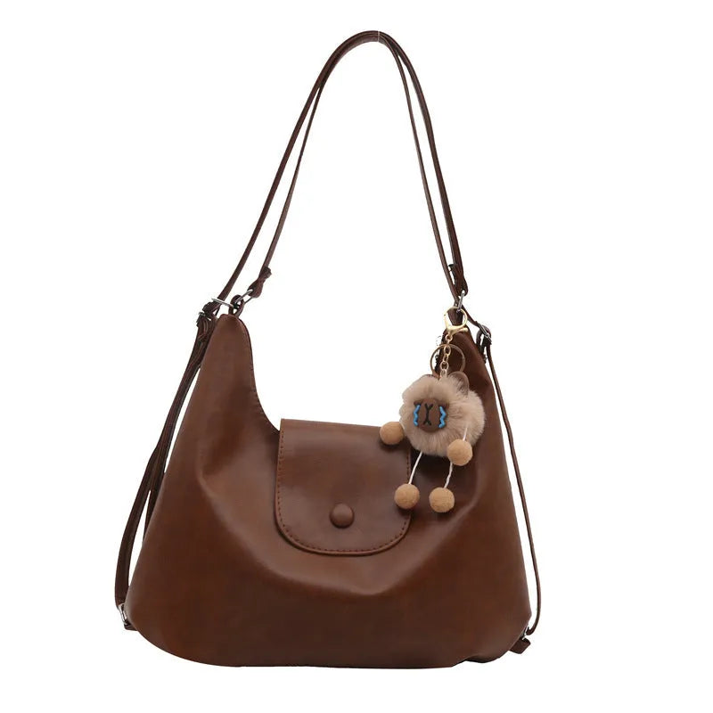 Large capacity textured PU commuter backpack with horizontal square shape and single shoulder strap