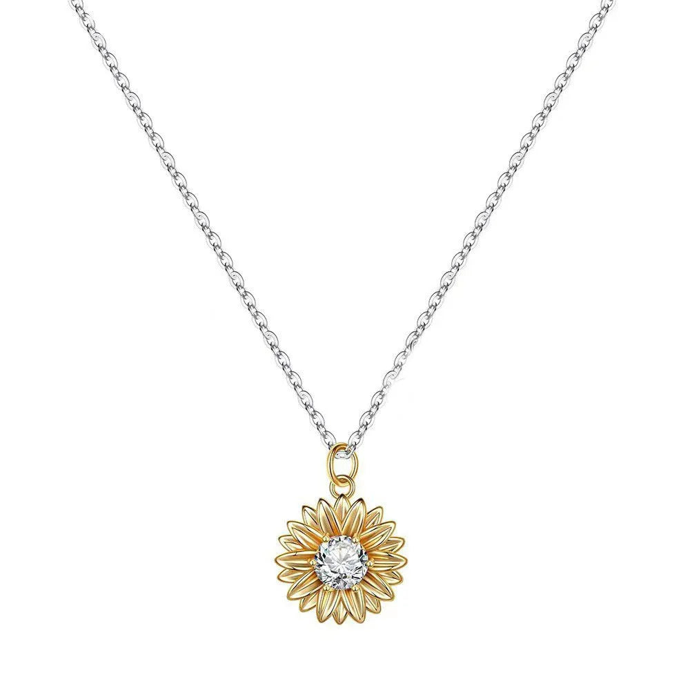 Geometric 925 silver sunflower necklace with daisy petal details on an adjustable cross chain.