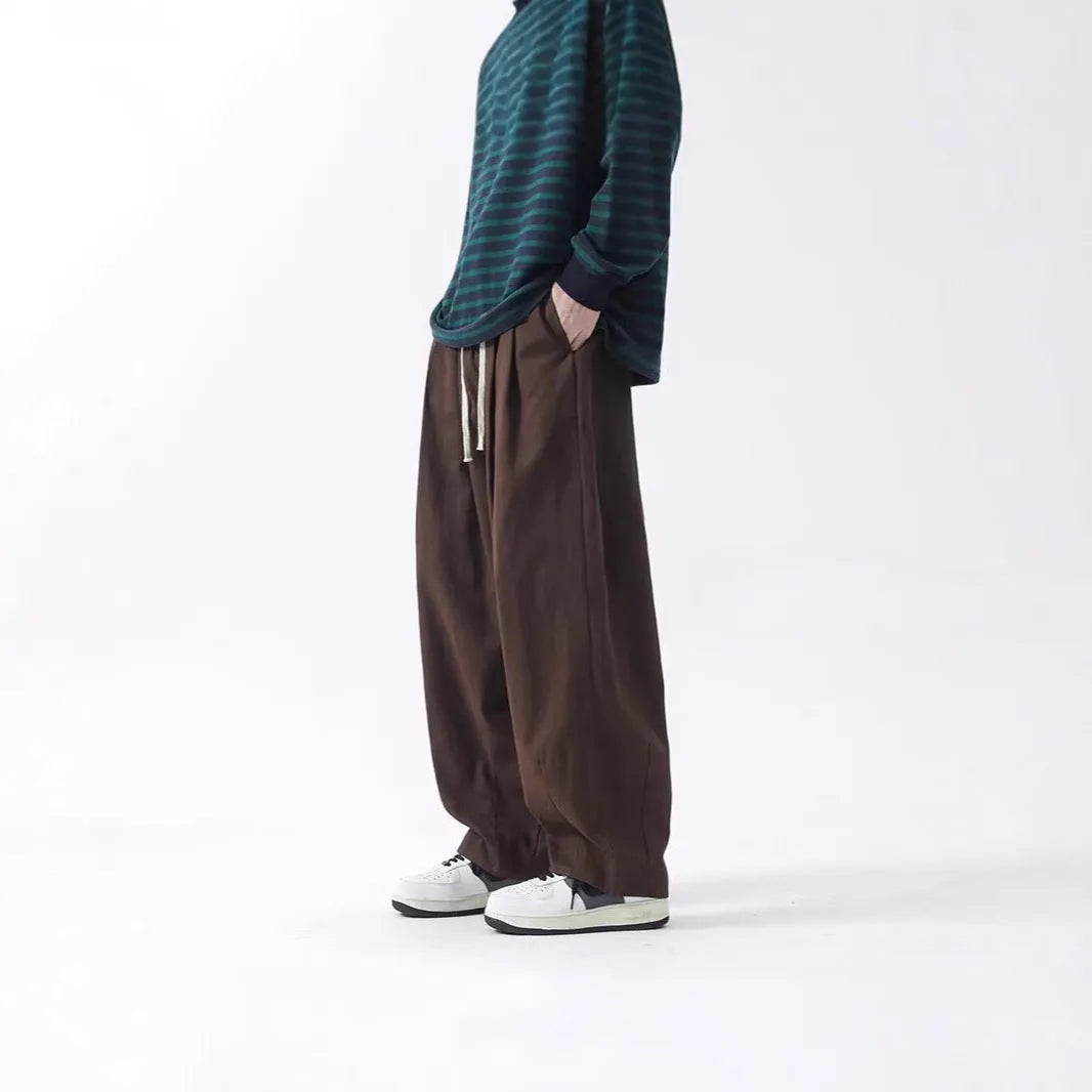 Cotton men's loose wide leg drawstring trousers in black and brown straight leg style with mid waist