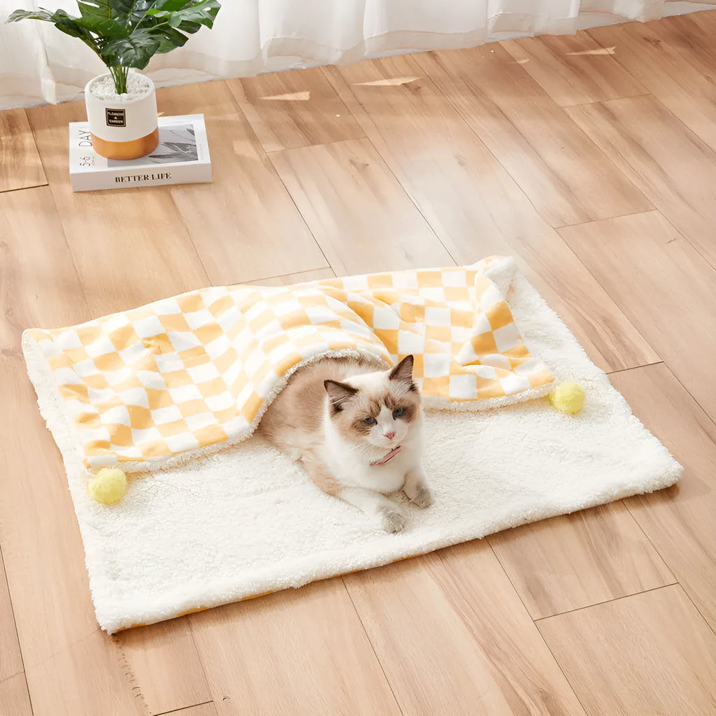 Soft plush pet blanket with plaid pattern and fur ball decoration for cats and dogs