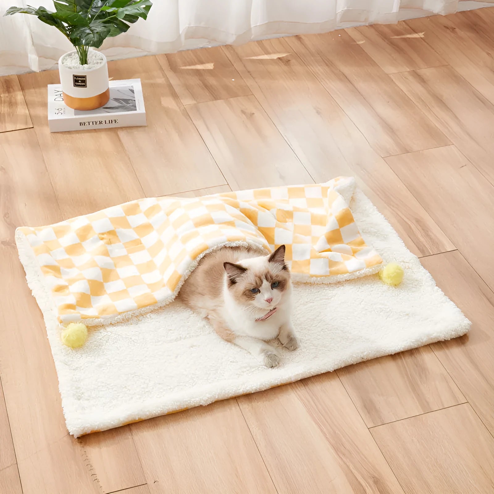 Soft plush pet blanket with plaid pattern and fur ball decoration for cats and dogs