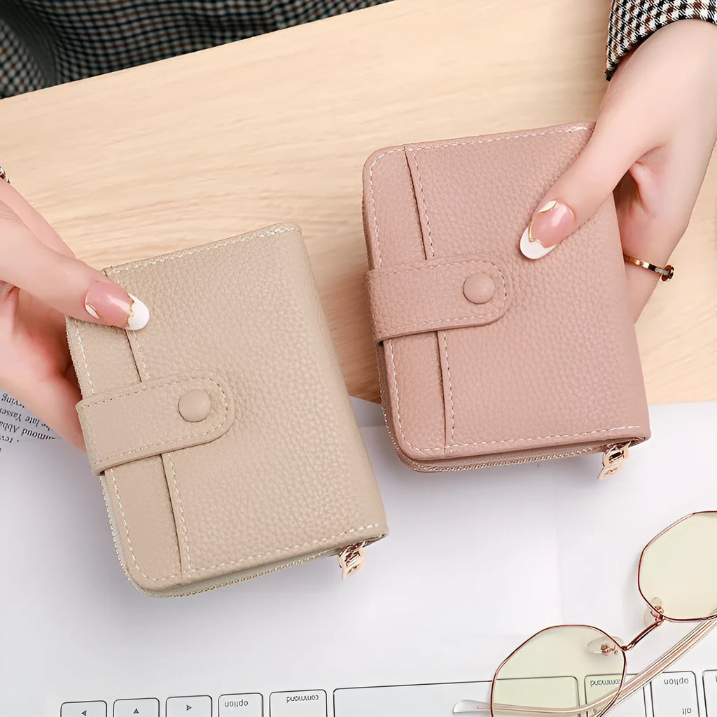 Women's lychee pattern PU short wallet in beige, pink, black, or red with antibacterial lining.