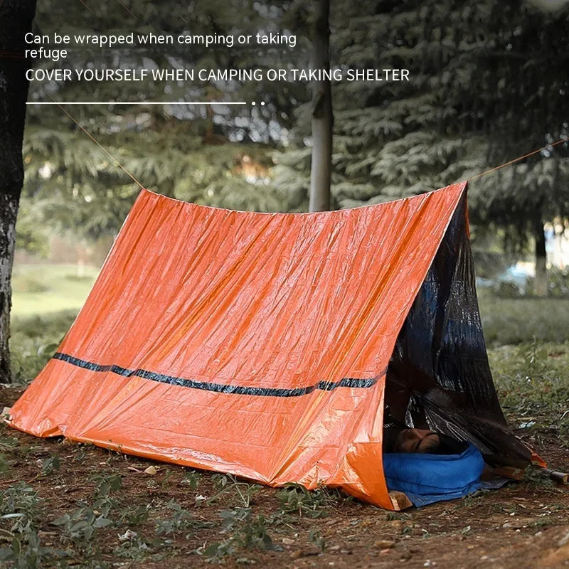 Emergency tent kit with sleeping bag and raincoat components for outdoor survival