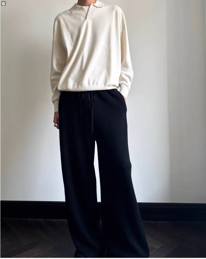 Pure wool polo sweater with lapel collar in milky white, shown in a loose fit.
