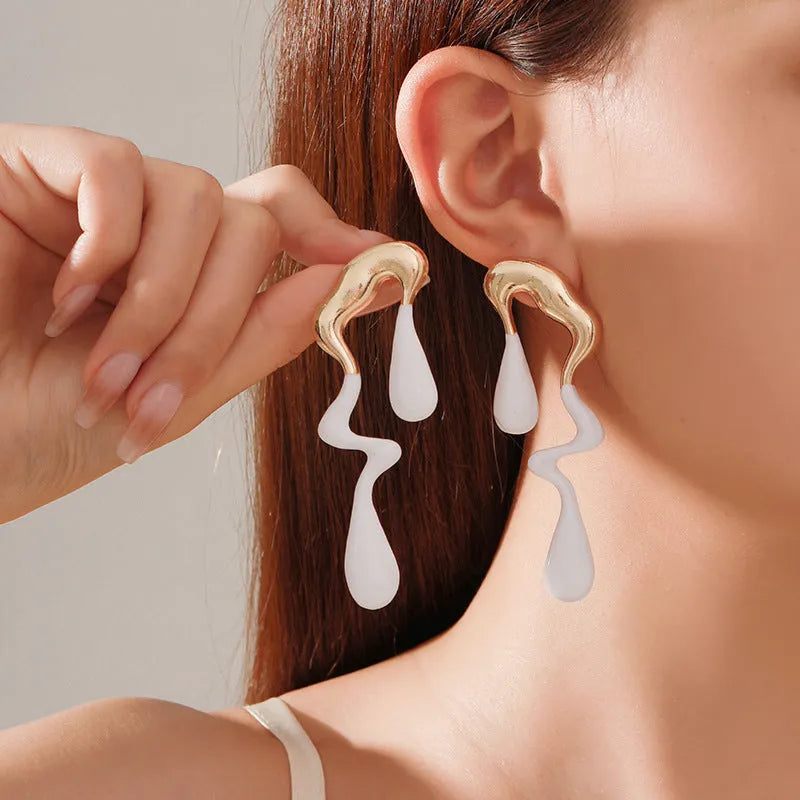 Liquid irregular geometric ear studs in gold, made from zinc alloy with electroplated finish, unique water drop design for women