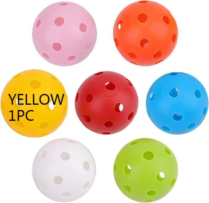 Multi-colour golf practice balls with 26-hole dimples, showing red, orange, blue, green, white, and yellow variants.