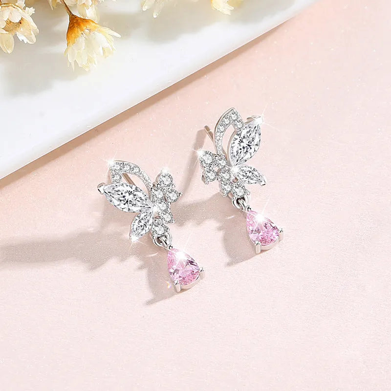 Silver stud earrings with butterfly shape and crystal accents in colour E0141