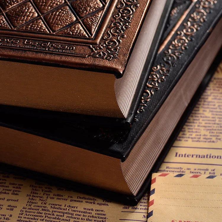 Embossed faux leather notepad with three-dimensional textured cover in bronze or black gold colour