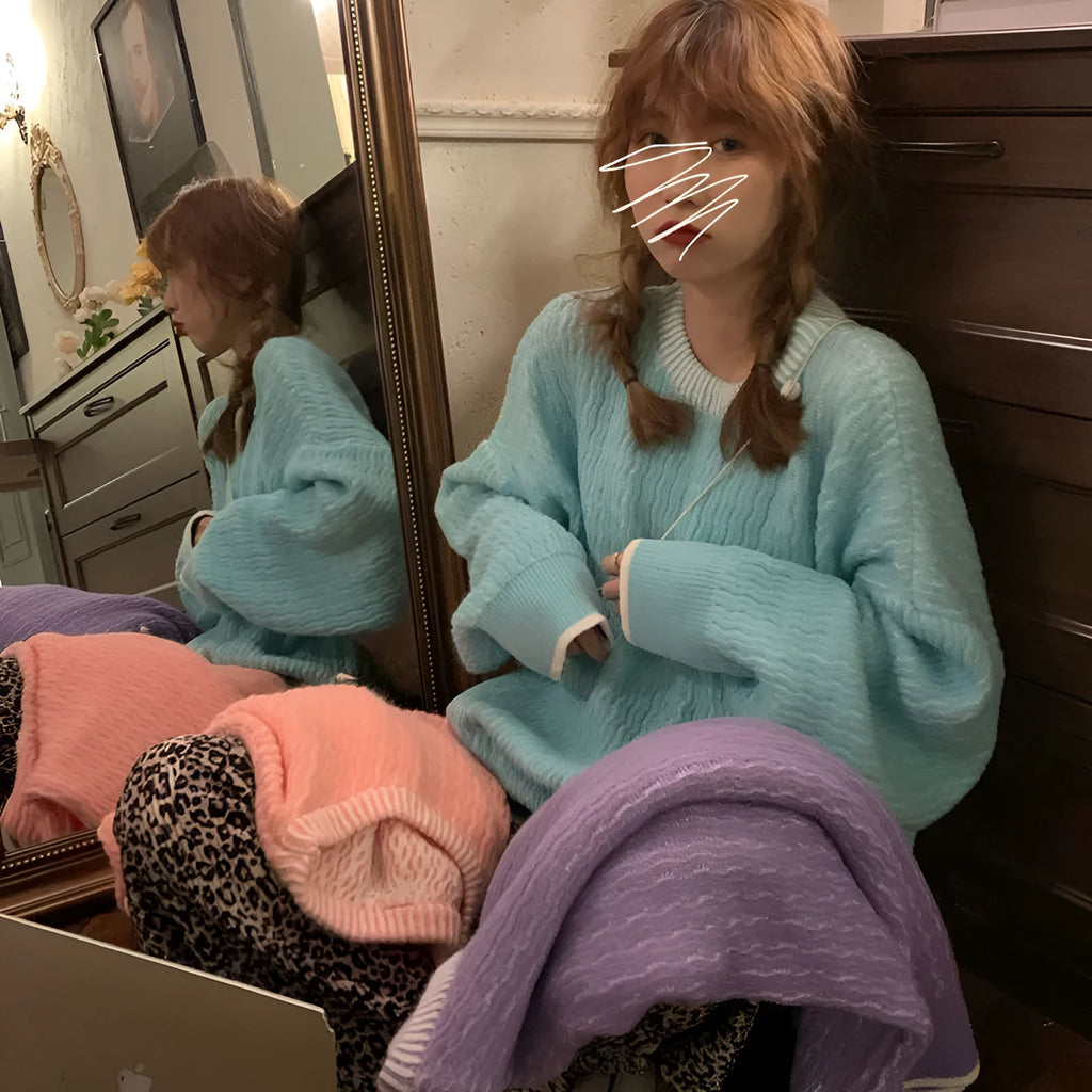 Women's loose retro pullover sweater in lake blue, purple, or pink, showing regular sleeves and a solid colour design.