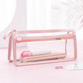 Transparent double-layer pencil case showing two compartments with stationery inside