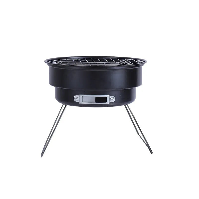 Small folding round outdoor ice stove and barbecue grill set with mesh, legs, and storage bag.