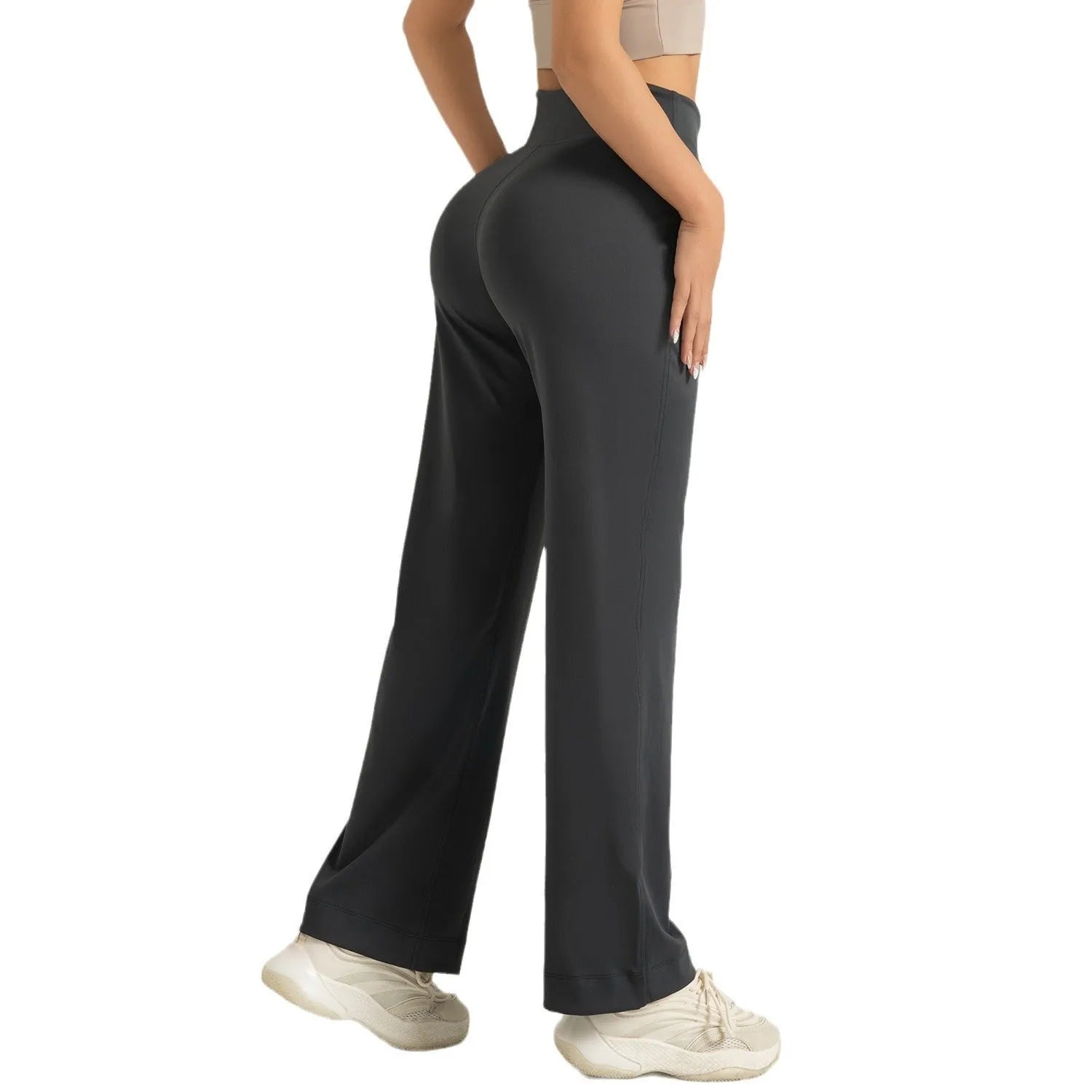 Women's high waist loose fit drawstring sports trousers in Star Black, side view, with elastic waistband and straight leg.