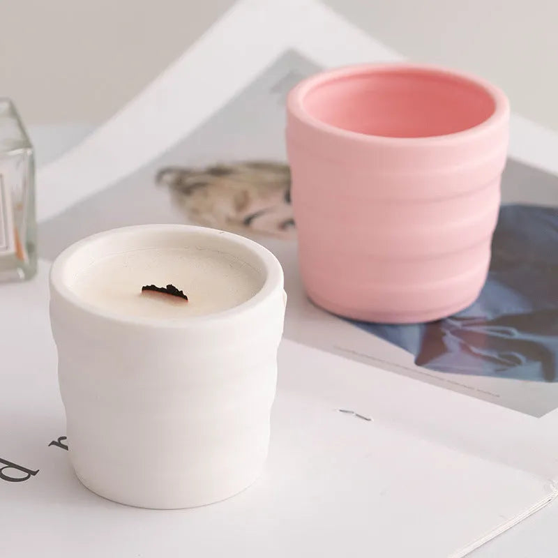 Minimalist ceramic round candlestick with relief pattern on a dining table