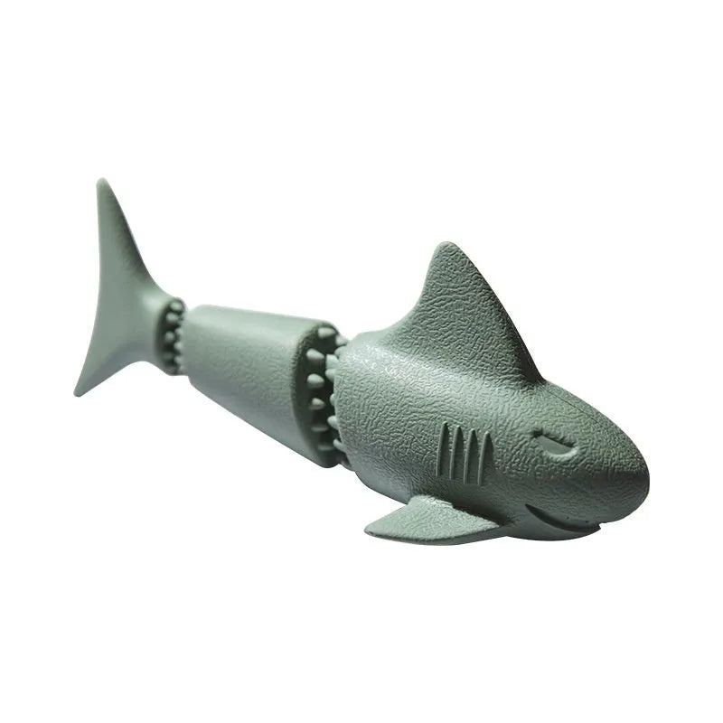 Blue rubber shark dog chew toy on a white background.