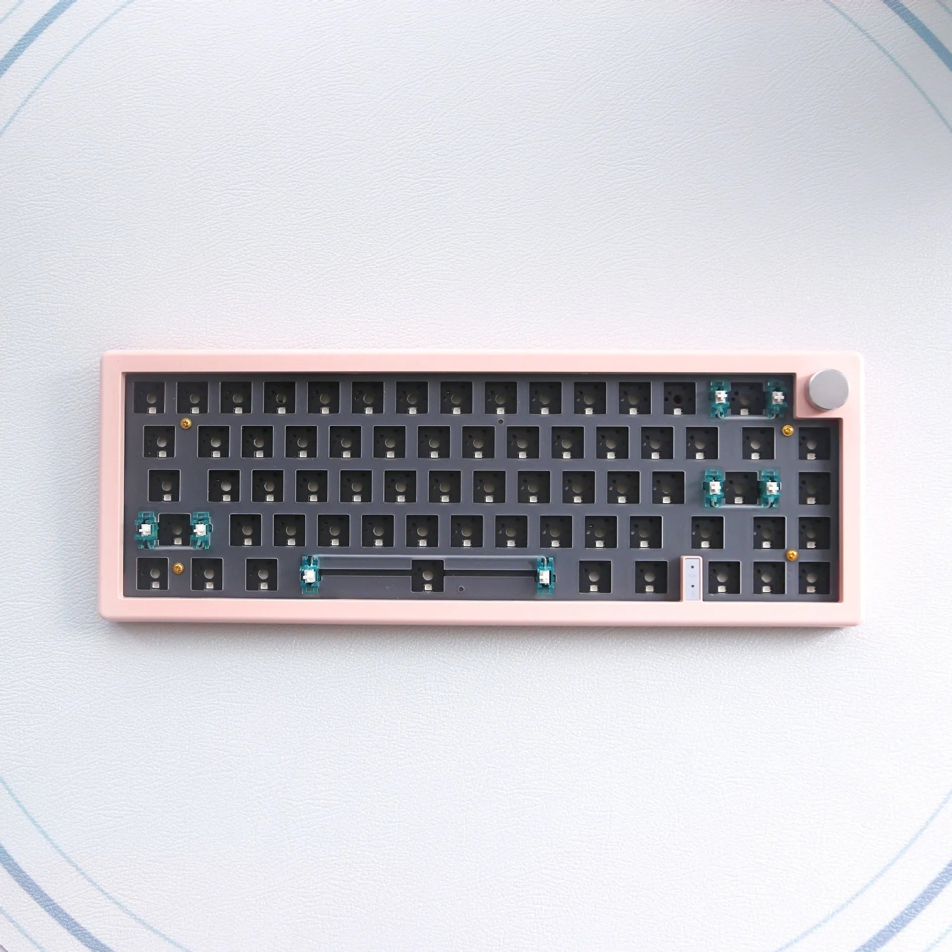 DIY mechanical keyboard kit with RGB backlighting and control knob in black, white, or coloured cases