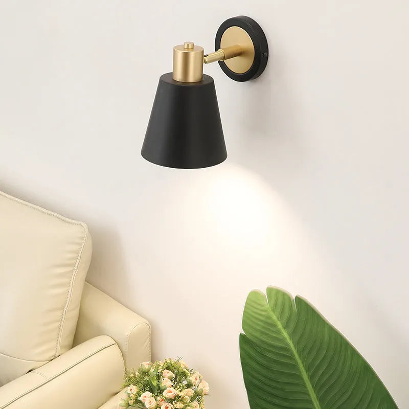 Nordic style iron wall lamp mounted on a wall beside a bed