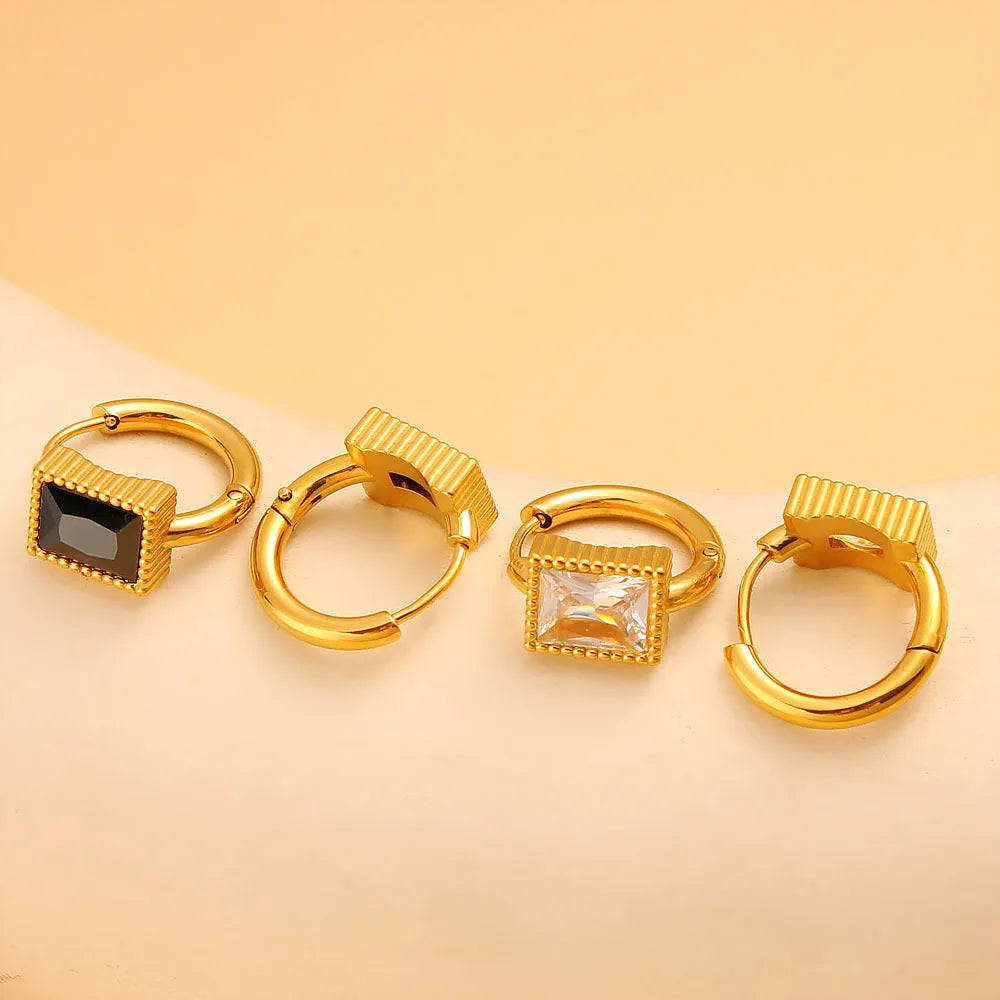A pair of square stainless steel earrings with round zircon details, shown in a choice of black, green, or white colour.