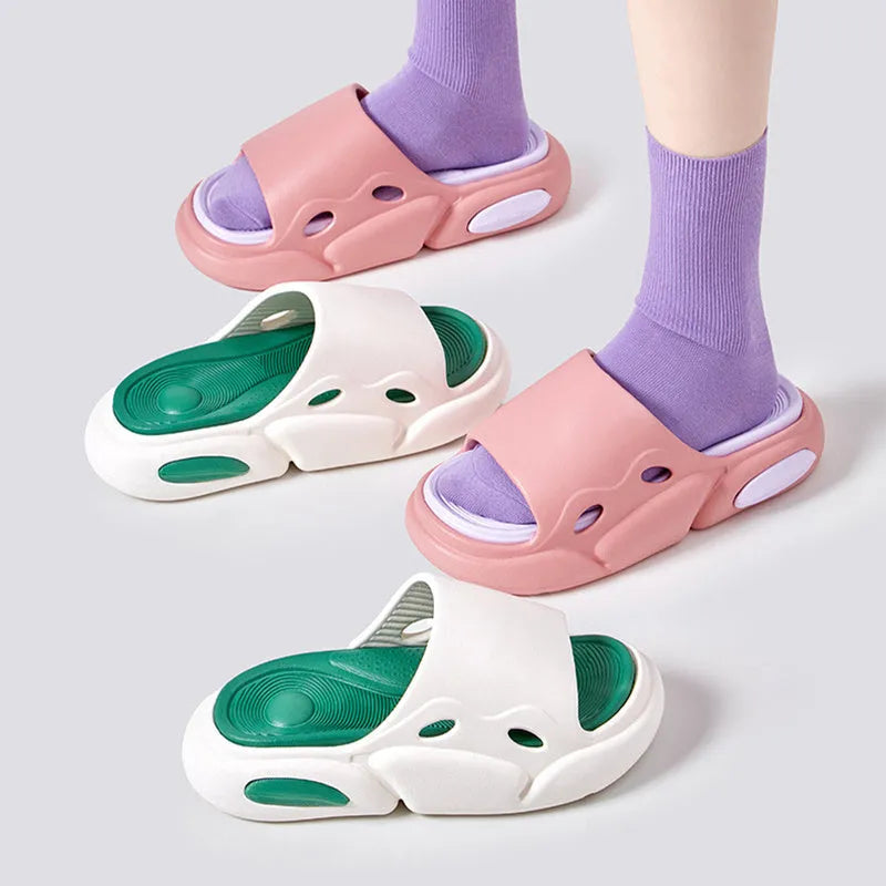 Two-colour EVA slippers with thick sole and leather lining in pink and purple.