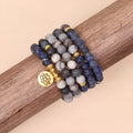 Multi-layer blue bracelet with patterned network stone beads on an alloy chain, natural style.