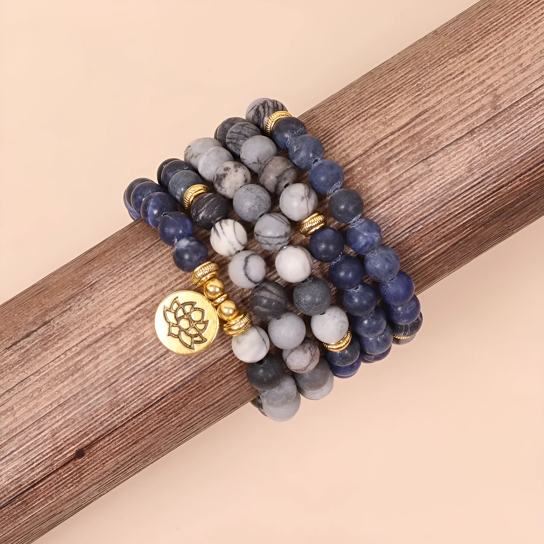 Multi-layer blue bracelet with patterned network stone beads on an alloy chain, natural style.
