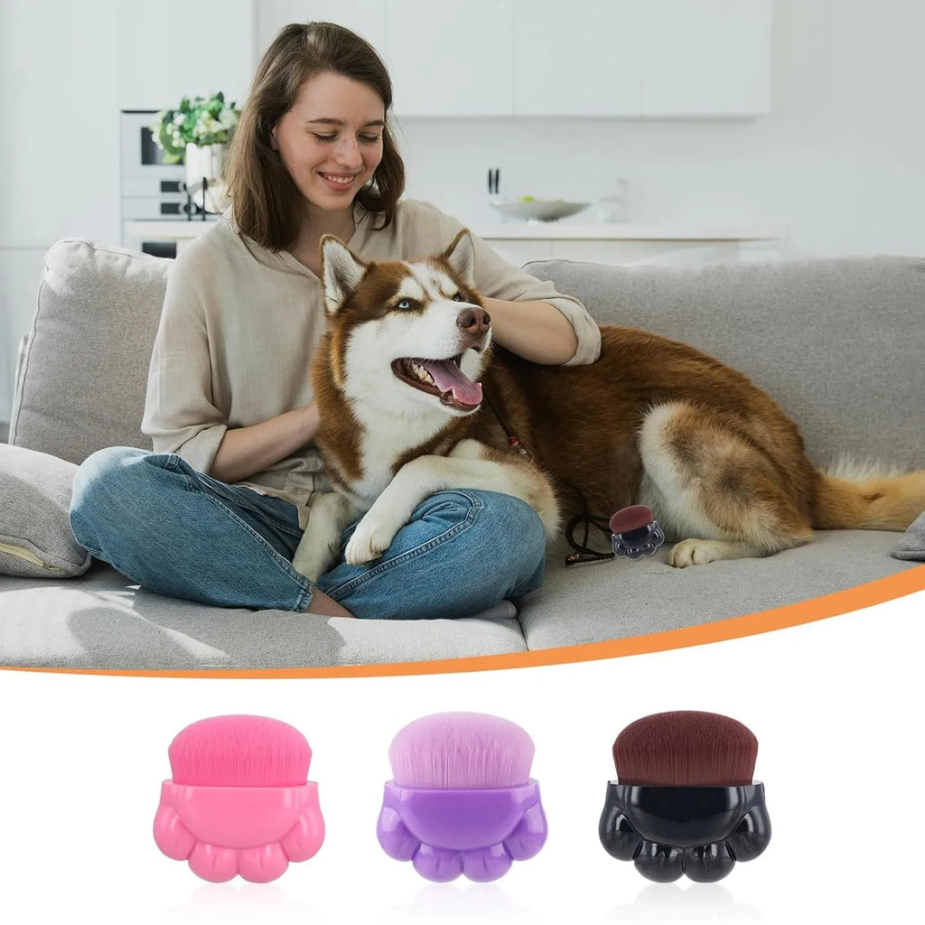 Three pet paw balm brushes with paw-shaped handles in individual storage boxes