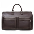 Brown genuine cowhide leather handbag with top handle and zip closure on beige background