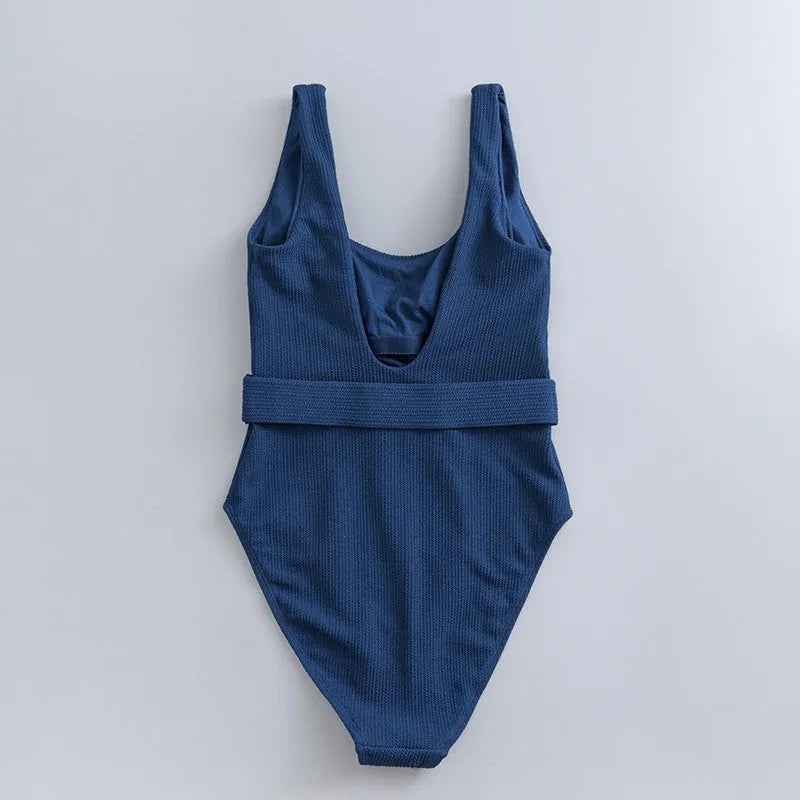 Navy blue women's one-piece slimming swimsuit with triangle neckline and chest pad.