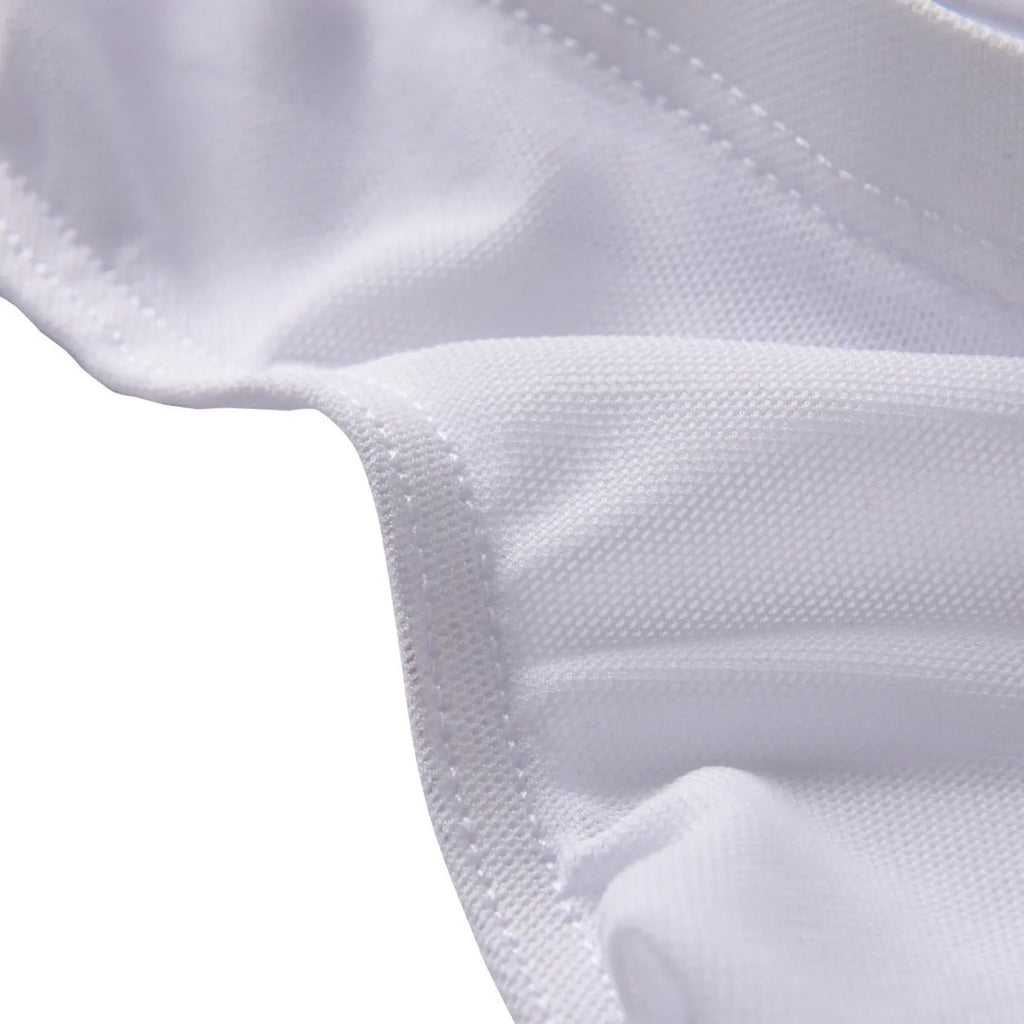 Men's black low-waist nylon brief shorts laid flat, showing triangle brief design and knitted fabric texture.