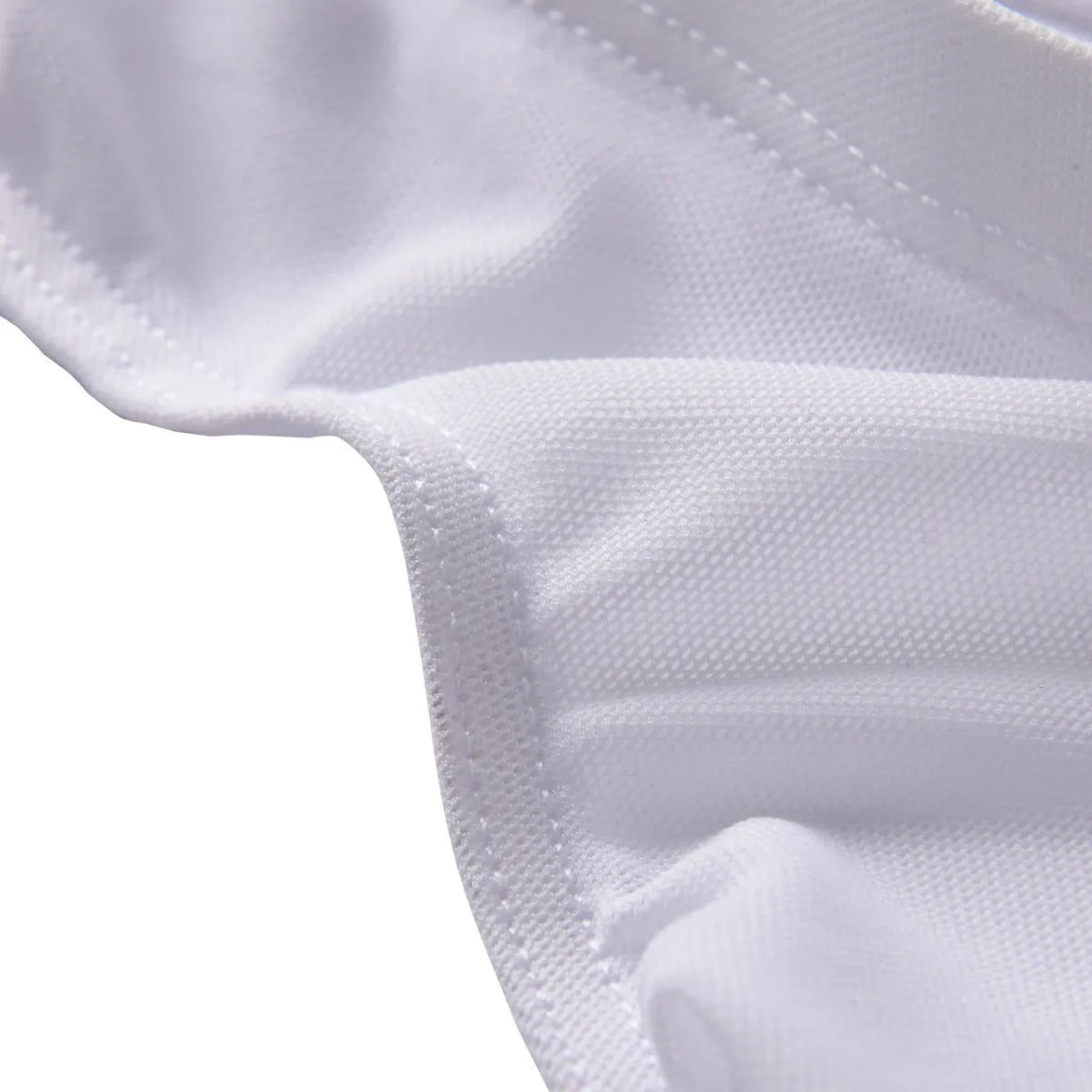Men's black low-waist nylon brief shorts laid flat, showing triangle brief design and knitted fabric texture.
