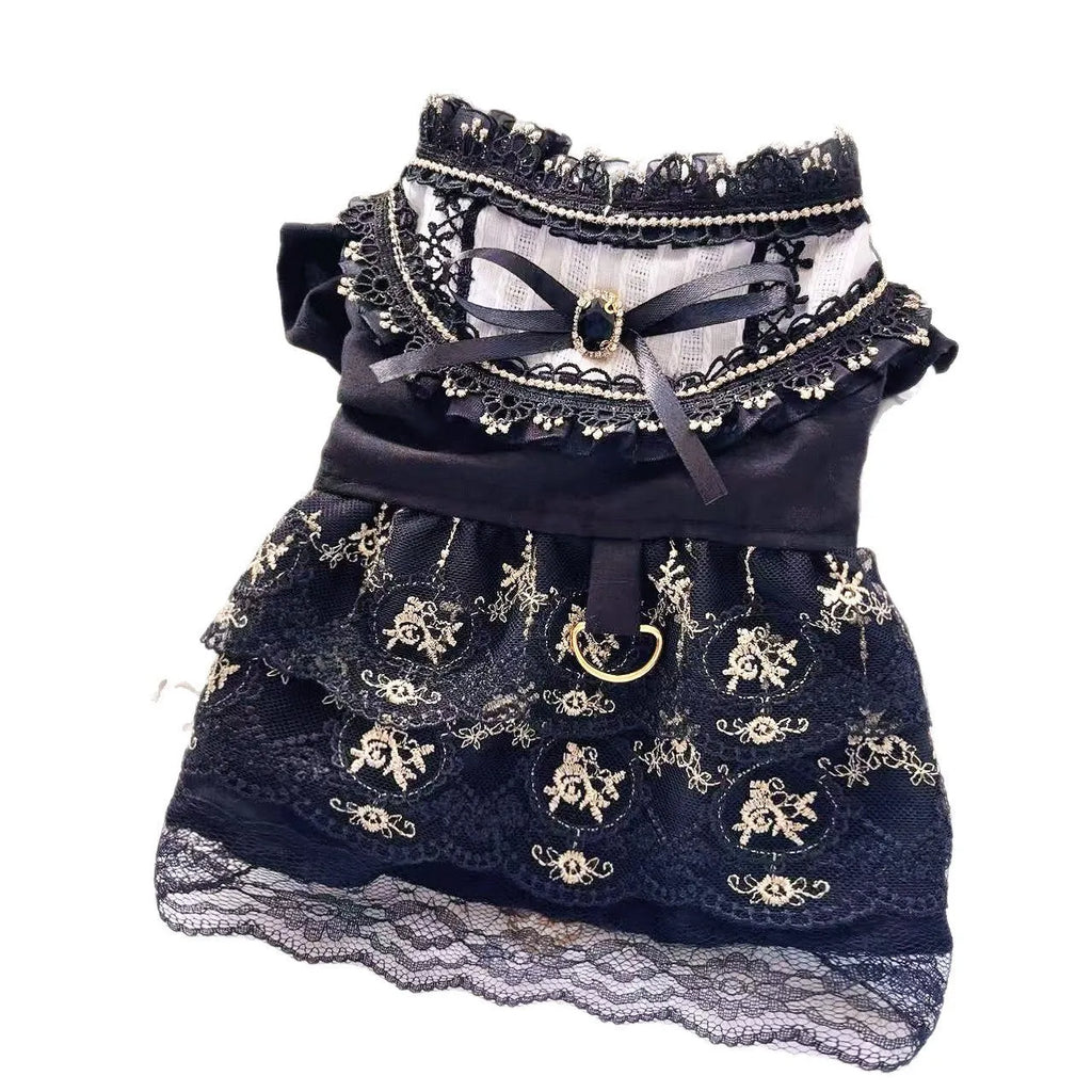 Golden tiered gothic-style skirt for a small dog on a mannequin, showing princess design.