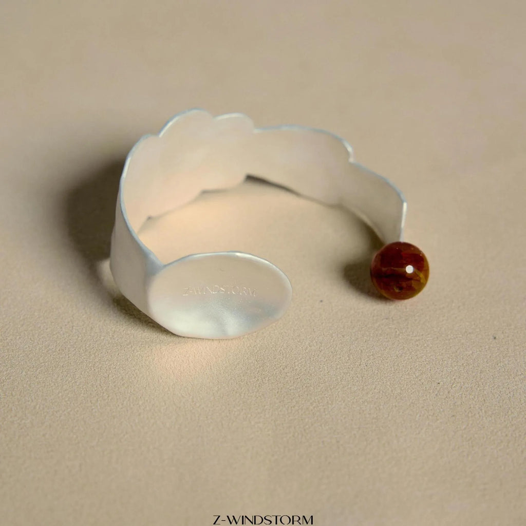 Small electroplated alloy jewellery piece with a diamond shape, shown as a bracelet or ring option.