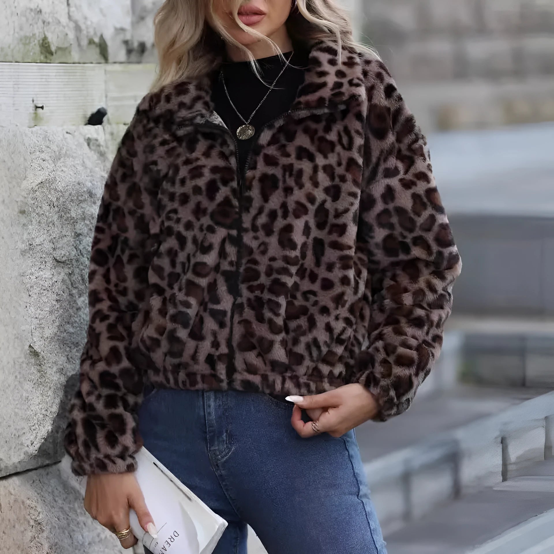 Women's loose fit leopard print plush coat with front zip and long sleeves.