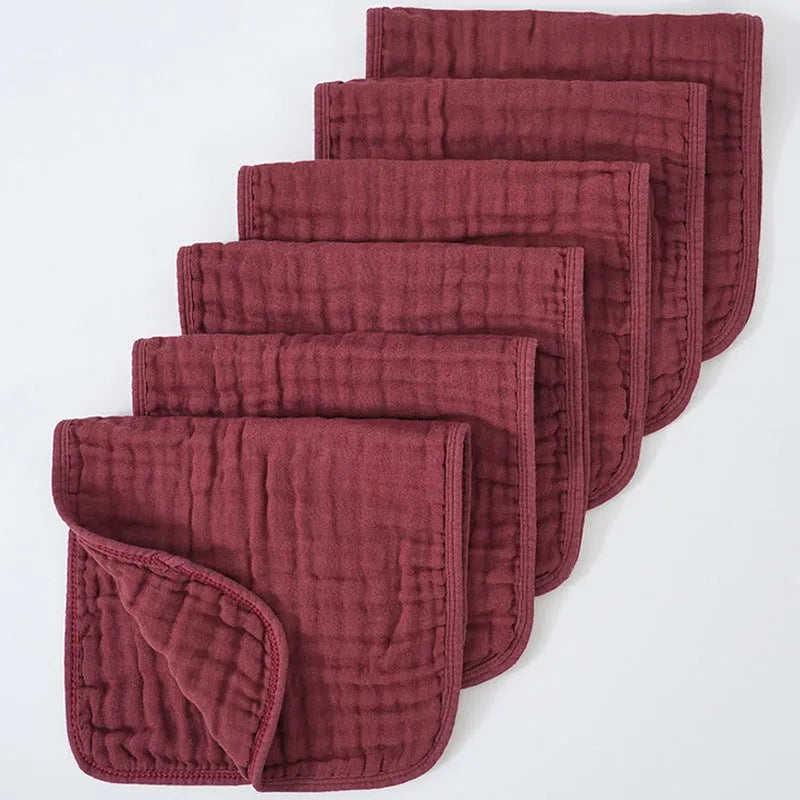 Set of six large muslin burp cloths 25x50cm in assorted colours on white background