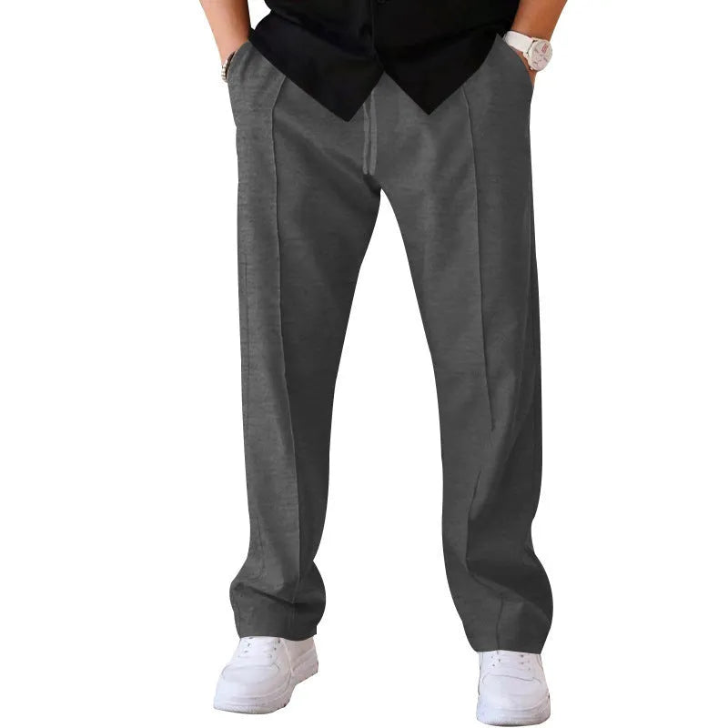 Men's loose straight trousers in waffle polyester with drawstring, available in multiple colours including black and light grey