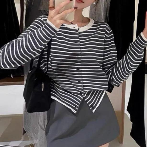 Dark grey and white striped women's cardigan coat with long sleeves and a short, slim fit.