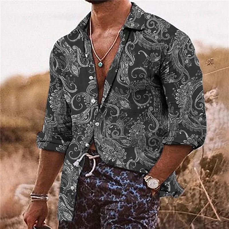 Man wearing a loose-fit long sleeve shirt with a detailed 3D floral print in a bohemian style.