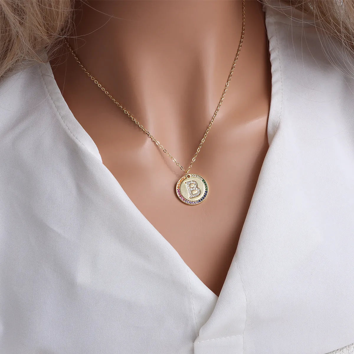 Gold English letter round pendant necklace with colourful crystals on clavicle length chain