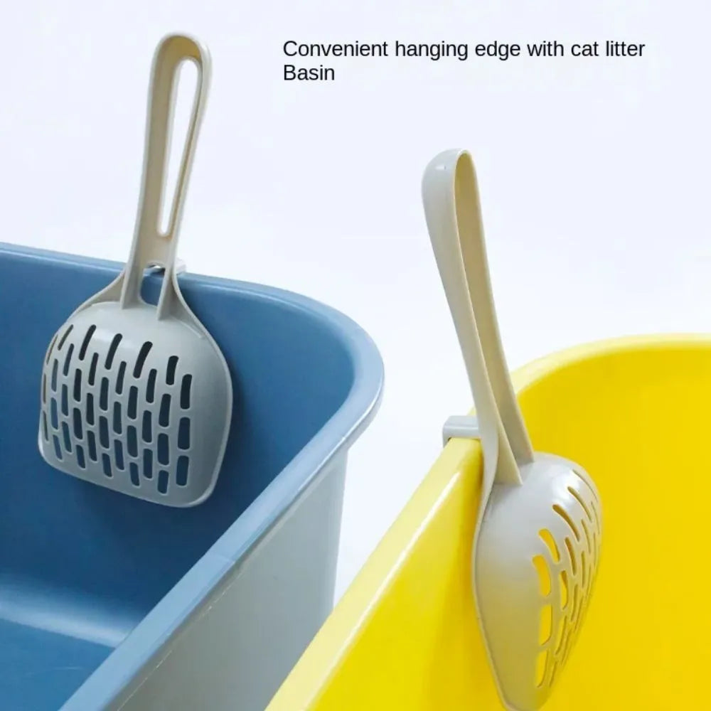 Grey plastic cat litter scoop resting in its matching plastic storage base
