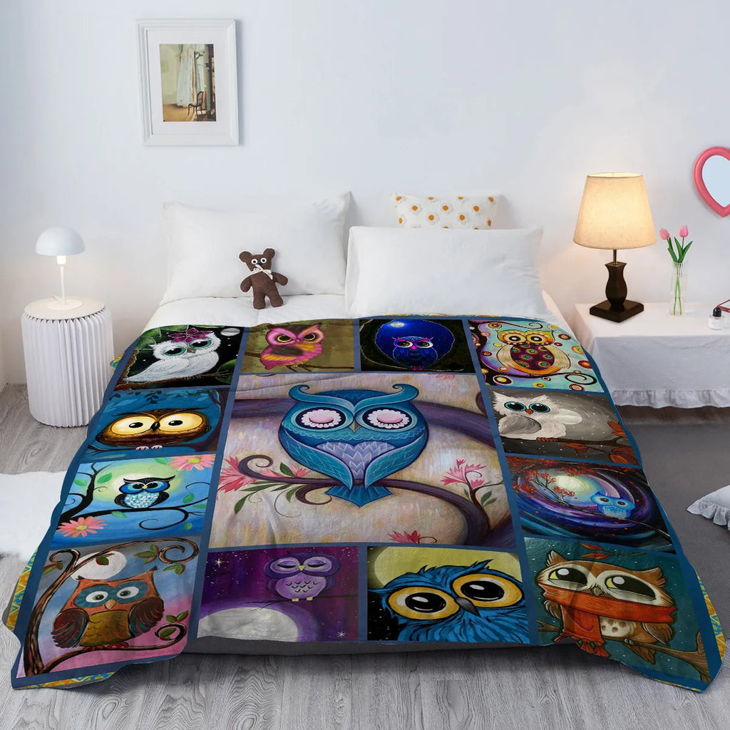 Flannel owl pattern soft fluffy multicoloured blanket in three sizes on a sofa setting