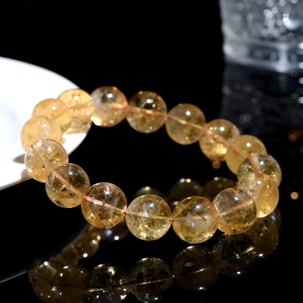 Natural yellow citrine Asestelle bracelet with geometric beads on a wrist.