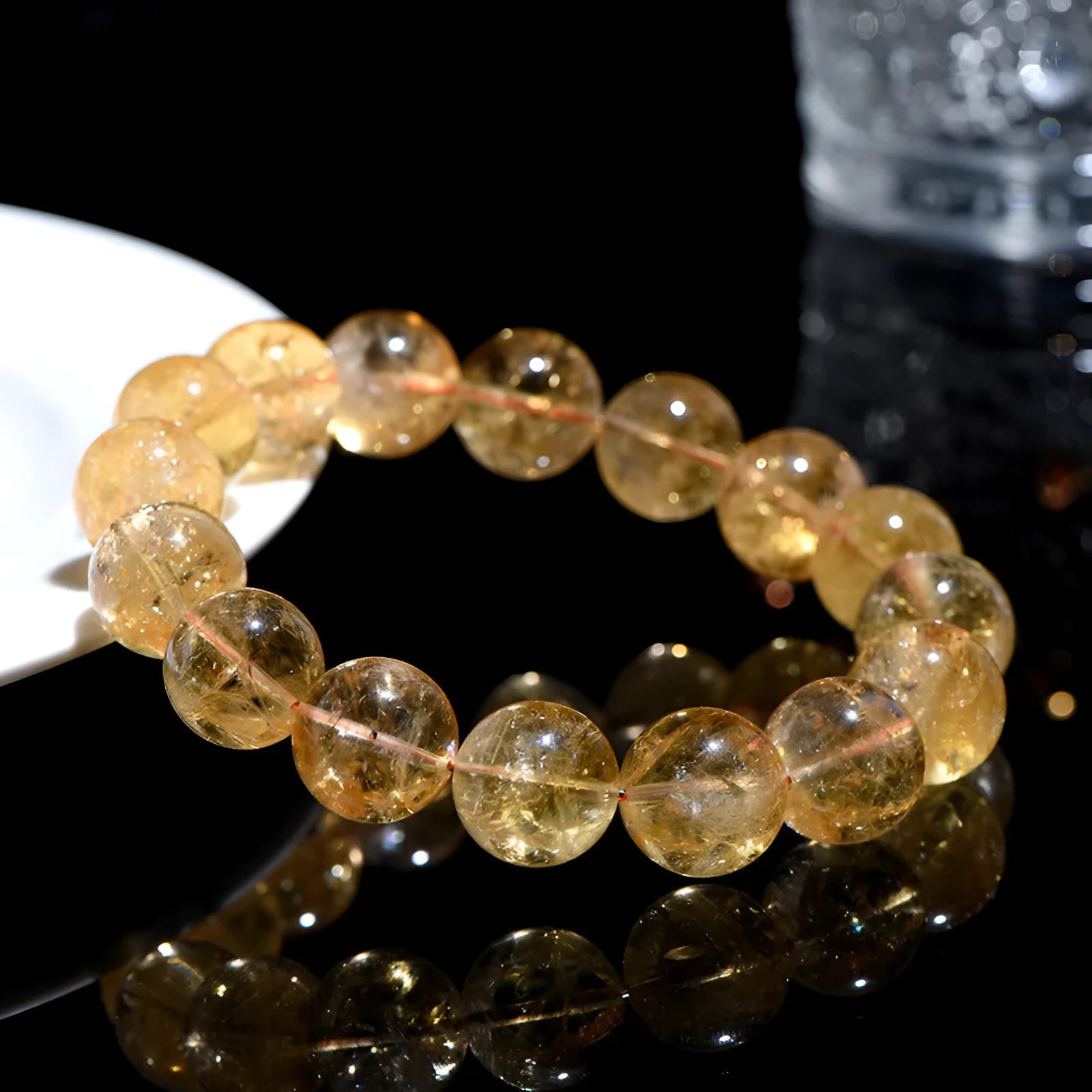 Natural yellow citrine Asestelle bracelet with geometric beads on a wrist.