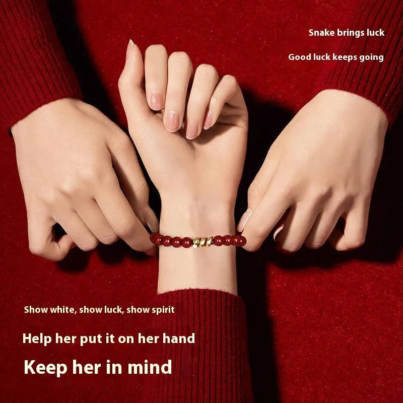 Handmade cinnabar snake year zodiac bracelet showing snake bead detail