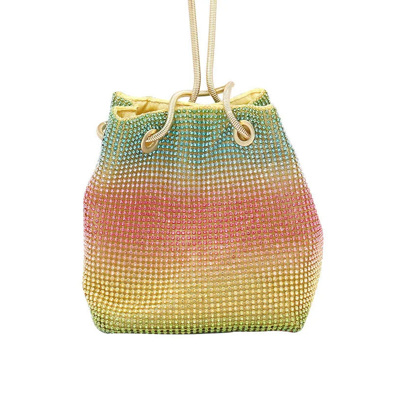 Soft rainbow rhinestone bucket bag with adjustable metal chain strap on a 28cm circular base.