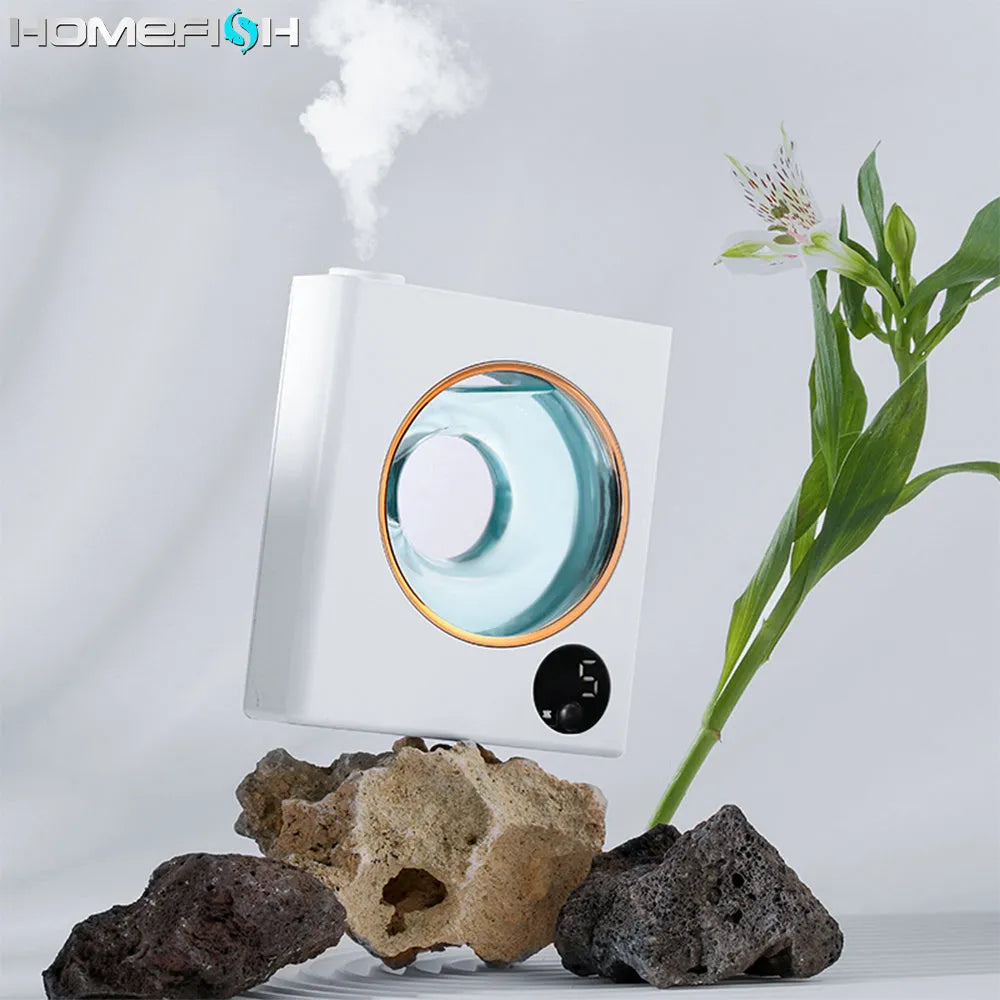 Small white wall-mounted automatic aromatherapy machine and essential oil diffuser.