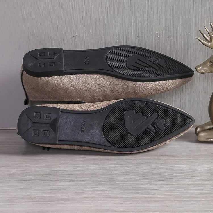 Beige leopard print women's pointed toe pumps with a rubber sole, shown in an extended size range.
