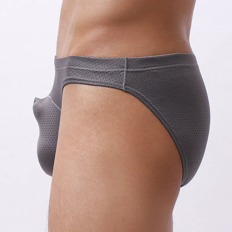 Men's loose-fit nylon briefs laid flat, showing light grey colour, elastic waistband, and breathable fabric texture.