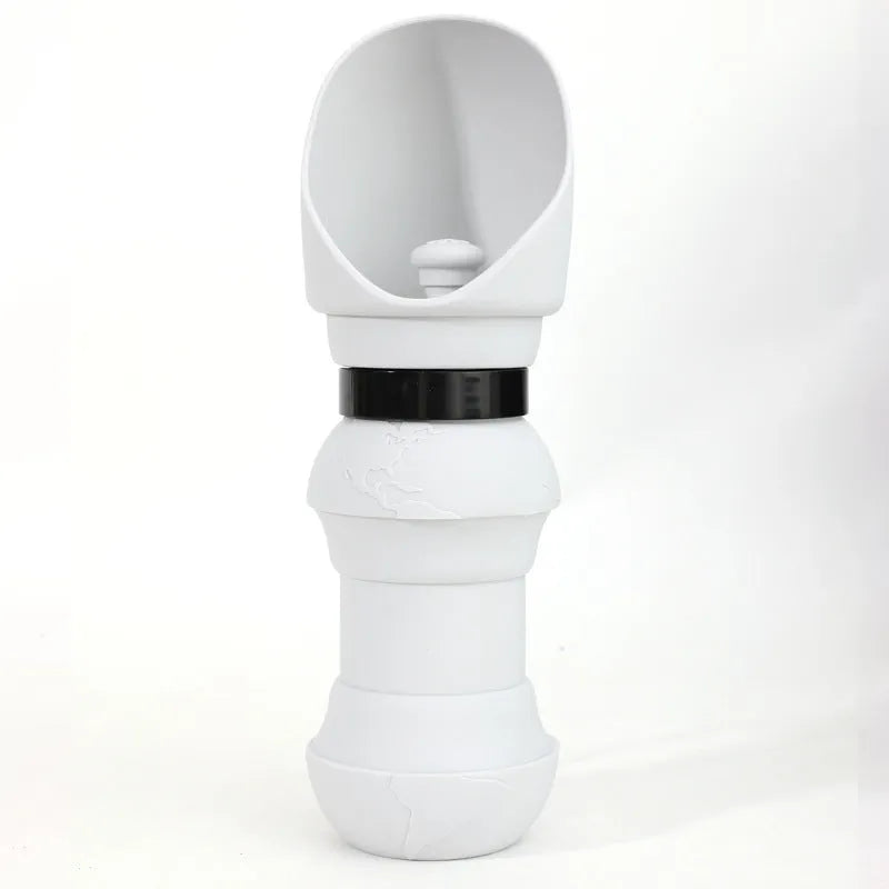 A folded flat and an unfolded silicone pet water cup in various colours including pink, black, and pineapple designs.