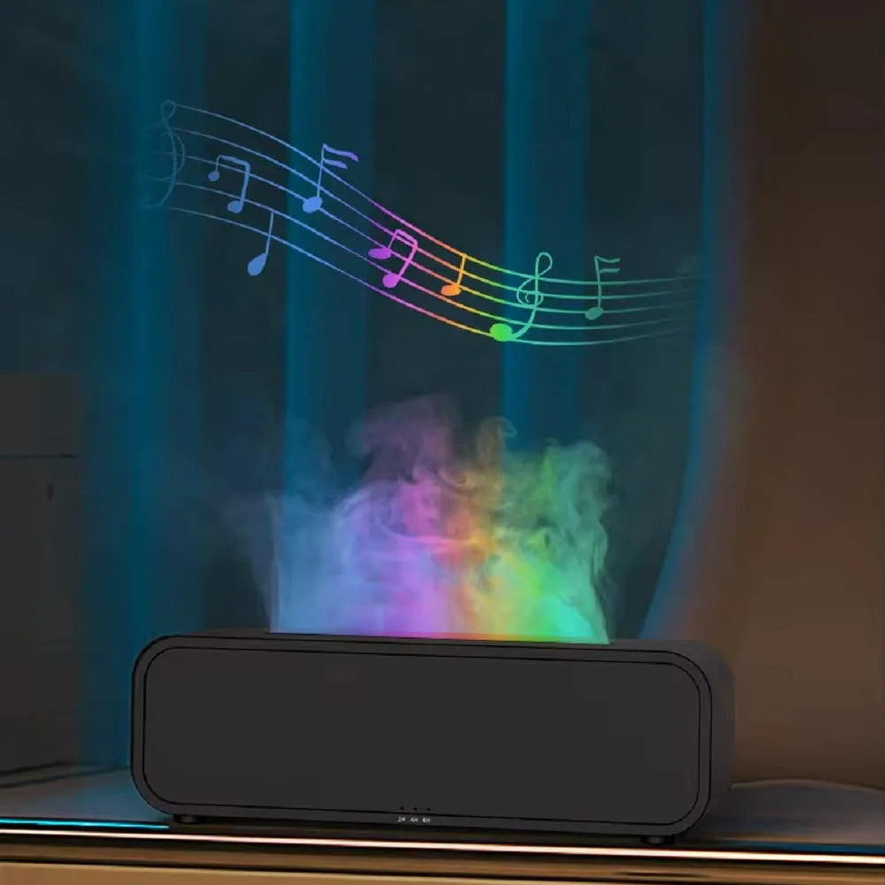 Black and white USB essential oil aromatherapy diffuser with colour-changing lights and remote control on a table