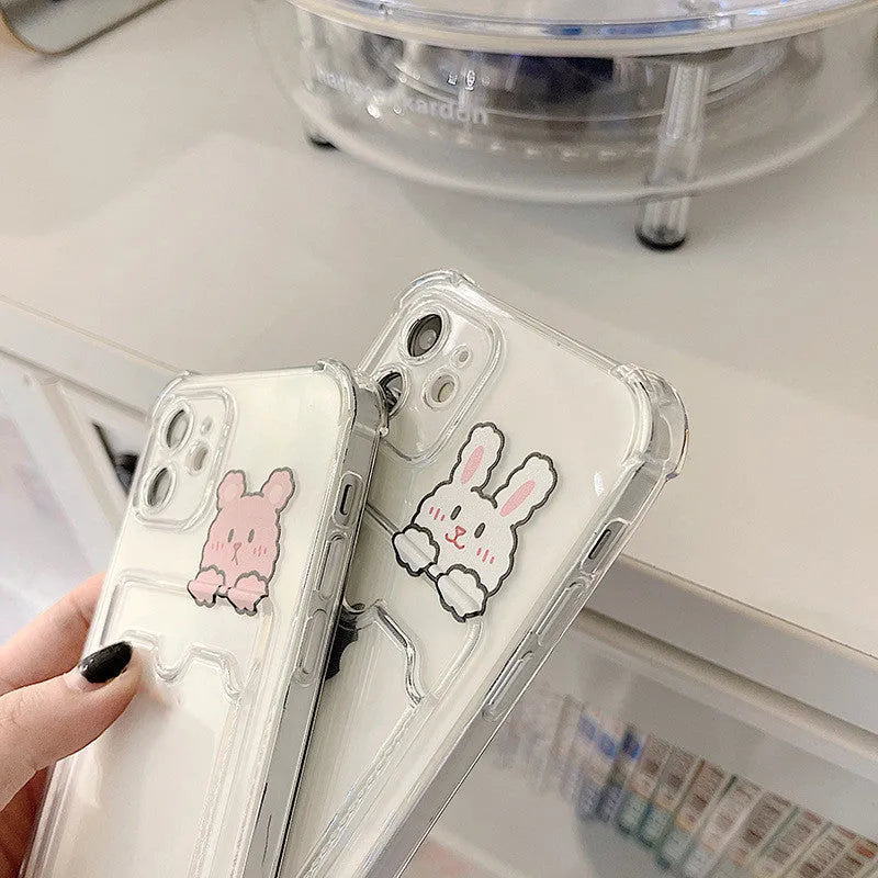 Transparent cartoon-design TPU iPhone case with a built-in card holder slot on the back.